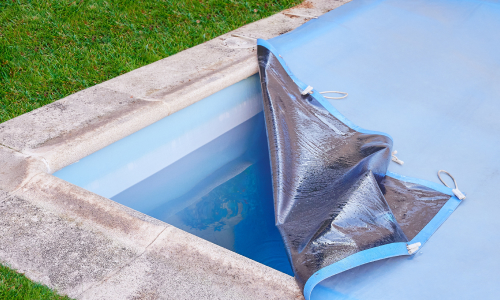 Swimming pool cover fixed